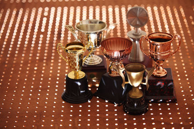 High angle view of trophies on table