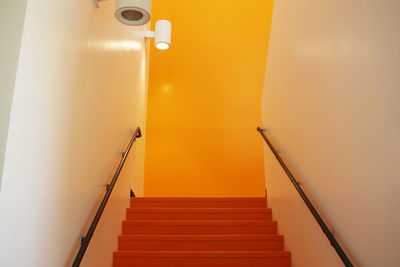 Low angle view of illuminated staircase in building