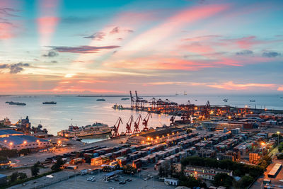 High angle view of city at sunset