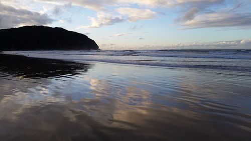 Scenic view of sea against sky at sunset