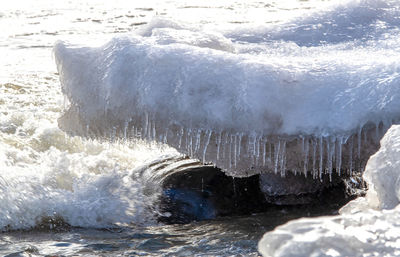 Waves splashing on frozen sea