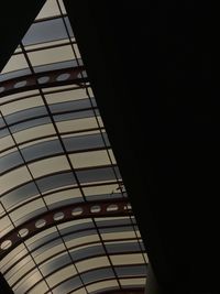 Low angle view of illuminated building against sky at night