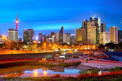 City lit up at waterfront