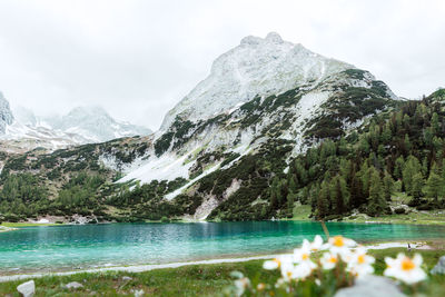 Scenic view of lake and mountains against sky