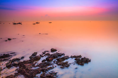 Scenic view of sea against sky during sunset