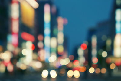 Defocused image of illuminated city at night