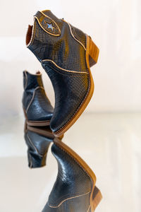 Close-up of shoes against white background