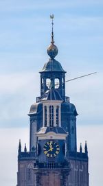 Clock tower of building against sky