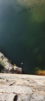 Scenic view of lake against rocks