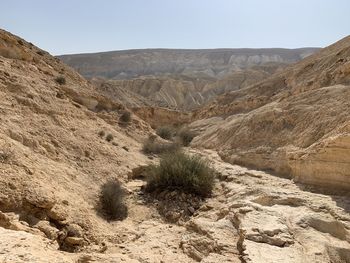 Scenic view of arid landscape against sky