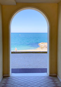 Scenic view of sea seen through window