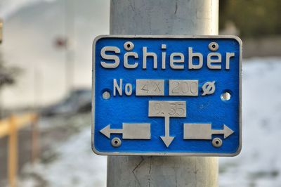 Close-up of directional sign
