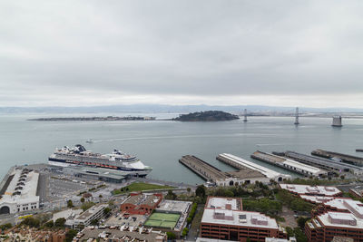 High angle view of harbor by sea against sky