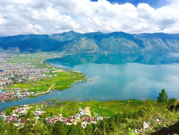 Scenic shot of calm lake against mountain range
