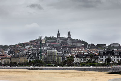 Buildings in city against sky