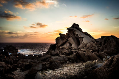 Scenic view of sea against sky at sunset