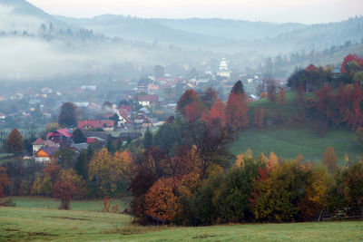 Trees on field against sky during autumn