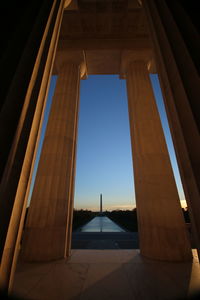 Low angle view of architectural column in historic building against sky