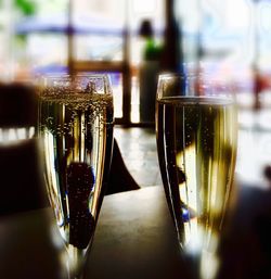 Close-up of wine glasses on table