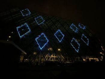 Low angle view of illuminated lights at night