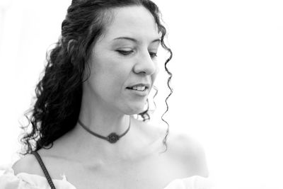 Close-up of woman against white background