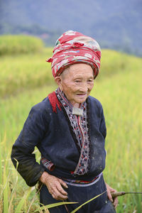 Man wearing hat standing on field