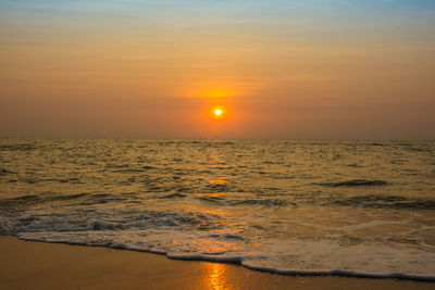 Scenic view of sea against sky during sunset.