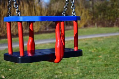 Close-up of empty swing in park