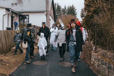 Group of people walking on street in winter