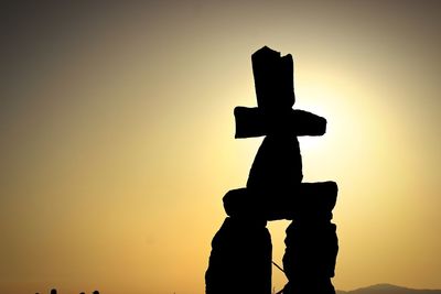 Low angle view of silhouette man against sky during sunset