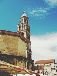 Low angle view of clock tower against sky