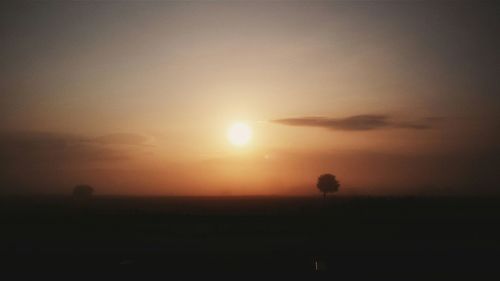 Scenic view of landscape at sunset