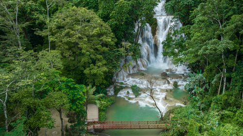 Aerial view tat kuang si waterfall in luang prabang, laos, beautiful waterfall in jungle tropical.