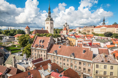 Buildings in city against sky