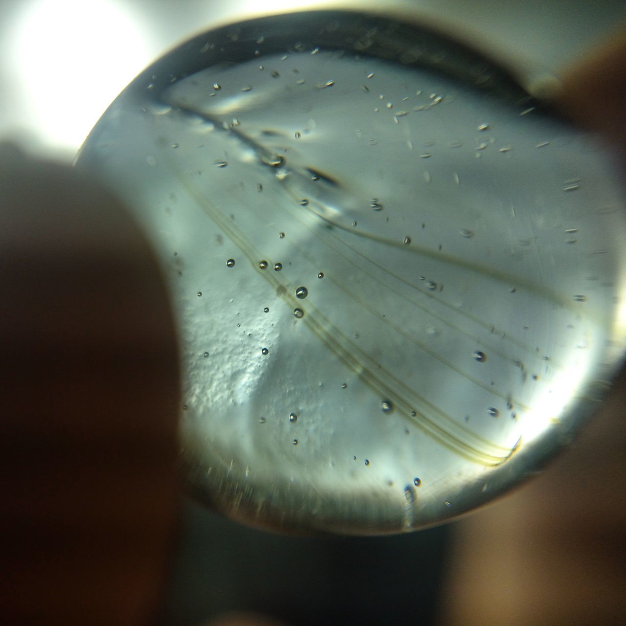 close-up, drop, indoors, refreshment, freshness, water, drink, focus on foreground, glass - material, transparent, food and drink, selective focus, wet, drinking glass, glass, purity, bubble, no people, still life, liquid