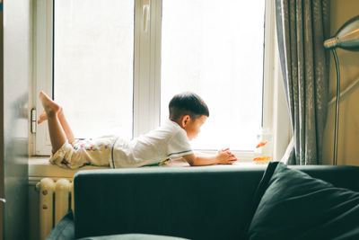 Man sitting on sofa at home