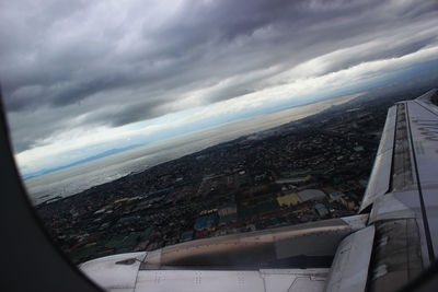 Aerial view of sea against cloudy sky