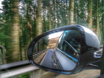 Reflection of car on side-view mirror