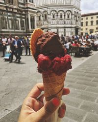 Cropped image of hand holding ice cream cone