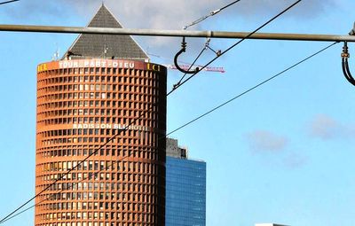 Low angle view of modern buildings against sky