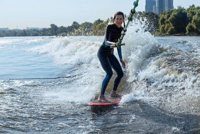 Woman wakesurfing in moskva river