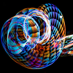 Close-up of multi colored illuminated lights against black background