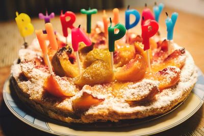 Birthday cake in plate on table