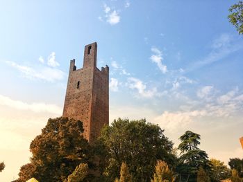 Low angle view of clock tower against sky