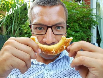 Close-up of man eating food