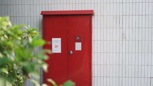 Red mailbox on wall