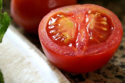 Close-up of tomato slice on marble