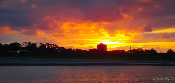 Scenic view of sea against romantic sky at sunset