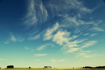 Scenic view of landscape against blue sky
