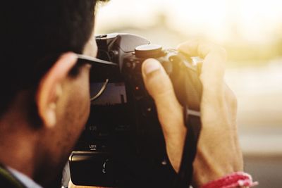 Close-up of man photographing